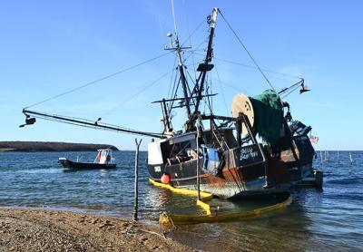 On Monday a boom was placed around the Miss Scarlett to contain any potential oil leaks; the oil was pumped out by the end of the day Tuesday.