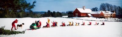 The photographer Ozzie Sweet depicted a bucolic New Hampshire winter in “Snowmobile Pulling 9 Sleds.”