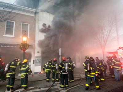 Smoke billowed from the doors of the Sag Harbor Cinema early Friday morning as firefighters worked to control a blaze that damaged or destroyed six buildings.