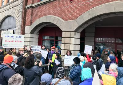 Constituents rallied outside Representative Lee Zeldin’s office in Riverhead on Tuesday.