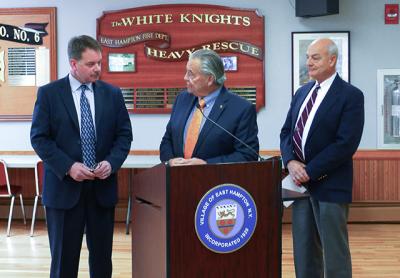 Chief Gerard Larsen of the East Hampton Village Police Department, left, who is retiring, was thanked for his service by Mayor Paul F. Rickenbach Jr. and Richard Lawler, the police commissioner and a member of the village board.