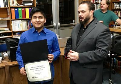 Kevin Chabla, a regional Scripps Spelling Bee runner-up, with Eric Casale, the Springs School principal