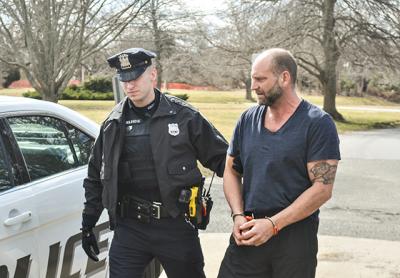 Jefferson Davis Eames was led into East Hampton Town Justice Court on Friday for his arraignment on multiple charges stemming from alleged under-age parties at his house.