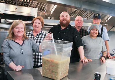 Volunteers gathered in the Scoville Hall kitchen to prepare for the annual soup and chili dinner sponsored by the Amagansett Presbyterian Church with contributions from Nick and Toni’s and Bostwick’s, among others. At Almond, its co-owner and head chef, Jason Weiner (below preparing headcheese for the first course), collaborated with Jeremy Blutstein from East by Northeast to concoct a “whole animal, cured, pickled, fermented, and preserved-things beer dinner.”