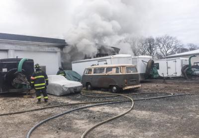 A fire broke out Tuesday morning in a bay of a commercial building that was rented out by a landscaping company.