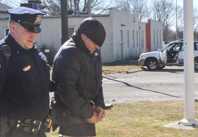 Jefferson Davis Eames was led into East Hampton Town Justice Court last Thursday afternoon for his arraignment on a felony charge of grand larceny.