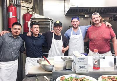 Those working in the kitchen for the five-course dinner featuring food from the countries covered by the Trump administration’s travel ban had origins as close as New York City and as far away as Ecuador and Mexico. They were, from left, Miguel Solano, Leo Cordova, Fabian Juela, Jeremy Blutstein, and Andrew Mahoney.