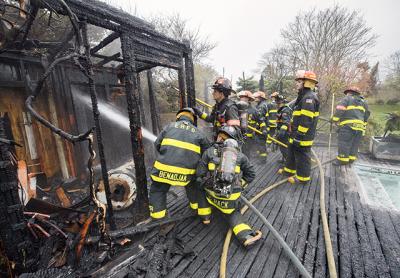 A pool house on a Georgica Road property was destroyed by flames on Tuesday. Fire officials said it had been burning a while before a passerby noticed.