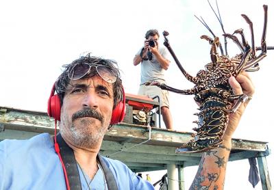 Dell Cullum, seen here on a film and photography expedition to the Galapagos with Billy Strong, has been temporarily sidelined after injuring his back during a fall from a ladder last week.