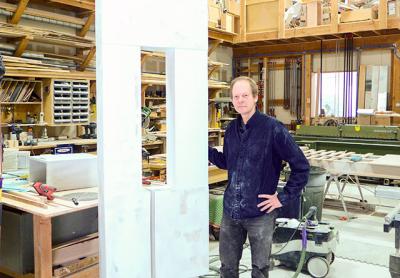 Mark Webber’s work in progress, seen here in his woodworking studio in Wainscott, is the largest of his signature “portals.”