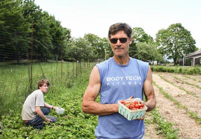 Erik Engstrom, left, works part time for Fireplace Farm helping Paul Hamilton.