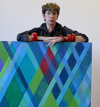 Arlene Slavin with one of the works from her “Intersections” series