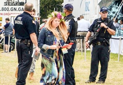 At Super Saturday in Bridgehampton, a benefit for the Ovarian Cancer Research Fund, Southampton Town police officers stood by with semiautomatic rifles.