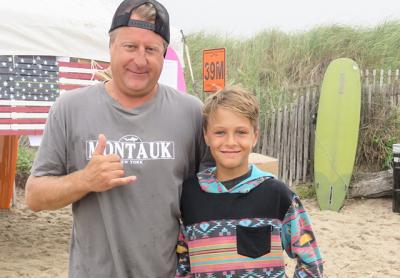 Craig Lieder congratulated his son, Chase, on getting first place in menehune short board contest and two third-place finishes in boys long board and open long board at the Rell Sunn Surf Contest at Ditch Plain Beach on Sunday.