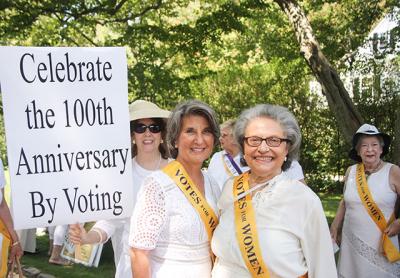 Arlene Hinkemeyer, right, of the League of Women Voters of the Hamptons was jubilant last Thursday at the league’s recreation of a 1913 women’s suffrage rally. With her was Brooke Kroeger.