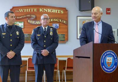 With words of praise from East Hampton Village Police Chief Michael Tracey, center, and Richard Lawler, right, a village board member who is also the village police commissioner, Steven Sheades was promoted on Friday to the rank of sergeant.