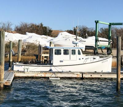 The columnist’s boat sat alone at its dock this week among those that have already been pulled out of the water.