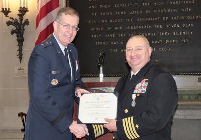 Major Gen. Mark Westergren of the Air Force presented Navy Capt. Joseph Pugh of Montauk and Edgewater, Md., with a Defense Superior Service Medal and the New York State Conspicuous Service Cross at his retirement ceremony on Friday at the United States Naval Academy in Annapolis, Md.