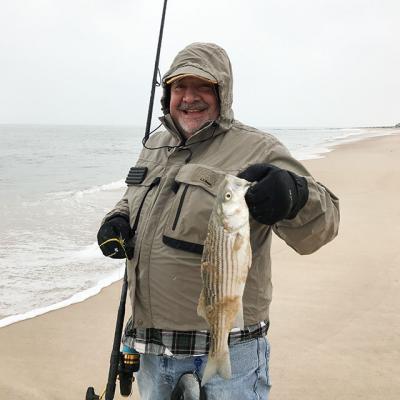 Joseph Fosella landed this striped bass near Georgica Beach in the snow on Saturday morning.