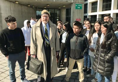 Daniel Rodgers, in hat, with friends and supporters of Bryan Siranaula, who was indicted yesterday in State Supreme Court in the alleged rape of a woman in the Springs School parking lot on Feb. 4. Mr. Siranaula entered not guilty pleas to the charges.