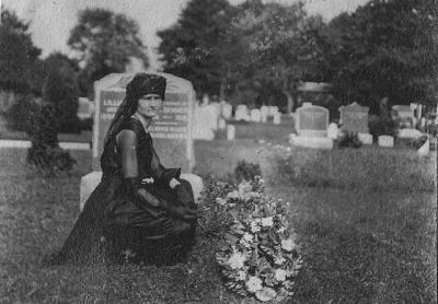 Lillian Swezey Skinner at the grave of her husband, Ira Skinner of Southampton, who died on March 13, 1919, during the flu pandemic.