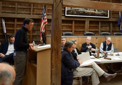 Rick Drew, left, spoke at Monday's meeting of the East Hampton Town Trustees about an increased wish-list for donations from the company planning an offshore wind turbine project that would generate up to TK megawatts of electricity. <I>Chris Walsh<P>