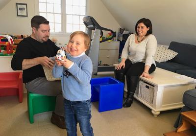 Rowland Egerton-Warburton, who was diagnosed with ADNP syndrome, a rare genetic disorder, at home with his physical therapist and behavioral instructor, only two of a long list of specialists contracted to help him develop communication and life skills.