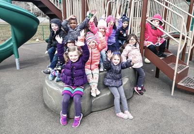 Children in the Eleanor Whitmore Early Childhood Center's prekindergarten program enjoyed time on the playground Monday after the regular school day was over.