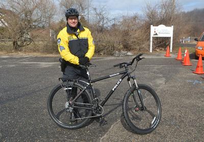 East Hampton Town Police Sgt. Dan Roman with one of two state-of-the-art patrol bicycles, now part of the department’s fleet