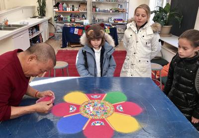 Lama Tenzin, a Tibetan Buddhist monk, constructed a sand mandala of compassion during a weeklong visit to the Ross School.