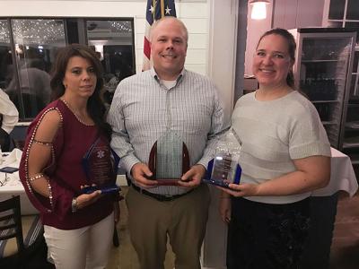 Mark Poitras received not one, but two awards from the Southampton Town EMS Advisory Committee’s dinner at the Coast Grill Friday night. He took home the Nancy Makson Award of Excellence and the Ralph Oswald Distinction for Inspirational Leadership. Pictured with him is Stacy McGowin, the Sag Harbor Volunteer Ambulance Corps Chief, and Violetta Zamorski, the head of the EMS Advisory Committee.