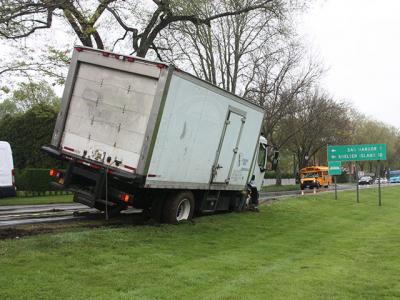 A six-wheeled box truck loaded with cargo got stuck on May 16 when it was driven off the road and onto the steep edge of the village green on East Hampton’s Main Street. Village Police Detective Sgt. Greg Brown said heavy rain played a role in the mishap. Police called Rapid Recovery to tie down the truck and winch it off the dirt so that it did not tip over. No tickets were issued.