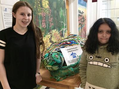 Sarah Betuel, left, and Maya Guzman, East Hampton Middle School students, are spearheading an environmental initiative launched by the Surfrider Foundation in which they plan to appeal to East Hampton restaurants and bars to go straw-free for the summer.