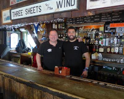 Jay Hamel, the owner of Murf’s Backstreet Tavern, posed with Robert Deery, a bartender. The bar has had to switch its closing time from 4 a.m. to 2 a.m.