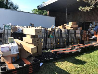 Packages have piled up outside the Montauk Post Office, as the Postal Service works to "align resources" to assist the office with the massive seasonal increase in package volume.