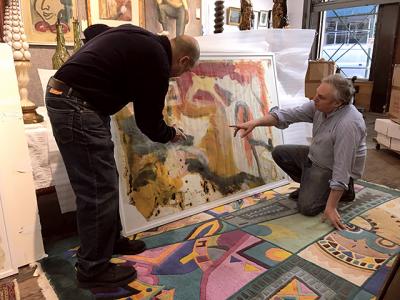 Larry Castagna, left, and David Killen examined one of the large-format drawings attributed to Willem de Kooning, part of a group of six works on paper found in a New Jersey storage locker.
