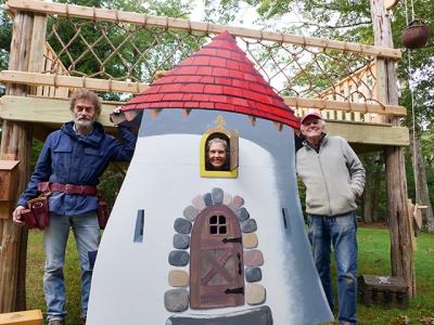 Posing with the castle-themed tree house they constructed for East Hampton Village’s fall festival were, from left, Toby Haynes, Jeanie Stiles, and David Stiles.