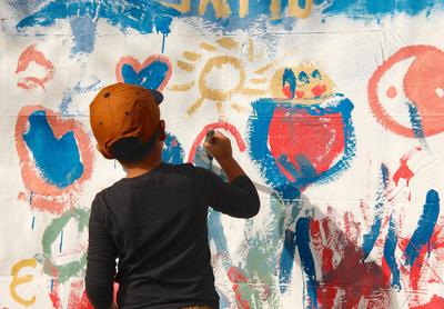 The East Hampton Chamber of Commerce’s second annual Fall Festival was a big hit on Saturday. Andres Zhungo joined in a mural painting project.