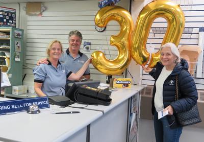 Bruce Howard, who has worked at the Montauk Post Office for 28 years, celebrated 30 years with the United States Postal Service on Monday with his co-worker Jeanne Stevens and a postal patron, Judy Morton.