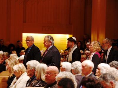 East Hampton Village Police Chief Mike Tracey, Mayor Paul F. Rickenbach Jr., Rabbi Joshua Franklin, and Rabbi/Cantor Debra Stein of the Jewish Center of the Hamptons filed into the synagogue’s packed sanctuary last Thursday evening.