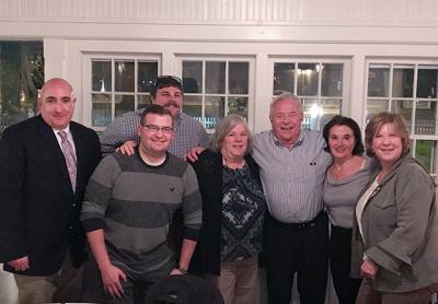 George Lombardi and his wife Antonia, third and second from right, held “a heroes dinner” for those who he said helped save his life. They are from left, East Hampton Fire Department Chief Gerard Turza Jr., Ian Hoyt, in back, Nick Calace, Suzy Dayton, and Barbara Hansen, far right.