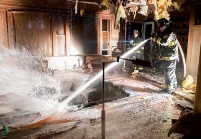 Firefighters found a hole that a fire had burned in the first floor of a house on Old Stone Highway in Springs.