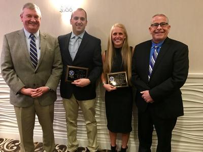 East Hampton Village Police Detective Lt. Tony Long, left, and Chief Mike Tracey, right, joined Police Officers Eben Ball and Bethany Semlear at a Southampton Kiwanis Club dinner to present them with officer of the year awards.