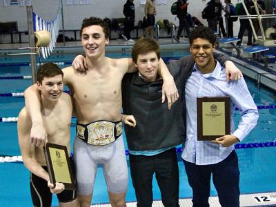 The four captains of the East Hampton boys swimming team, Ryan Duryea, Ethan McCormac, Ryan Bahel, and Jordan Uribe, posed afterward with the team’s plaques.