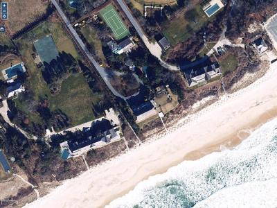 The owners of 33 Lily Pond Lane in East Hampton, at center, want to replace their house with one larger and farther removed from the ocean shoreline.