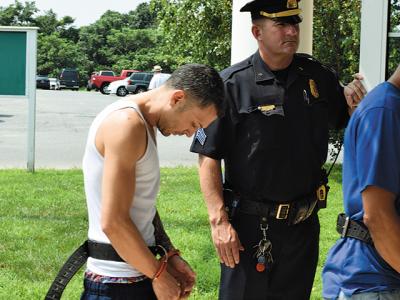 William Crespo-Duran, seen here being led into East Hampton Town Justice Court back in August, will face a Suffolk County Criminal Court judge in April for sentencing on charges related to a Montauk drug bust last summer.