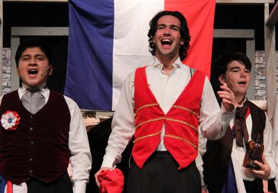 At a dress rehearsal on Monday for the East Hampton High School production of “Les Misérables,” Kevin Chabla, left, Vincenzo Salsedo, center, and Brody Eggert proved they were ready for opening night tomorrow.