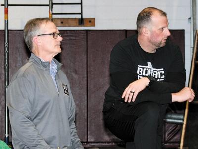 After about a decade, Jim Stewart, at left, has retaken the varsity wrestling reins here, with the assistance of Steve Redlus, at right.