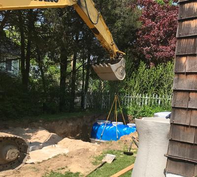 By taking advantage of two programs, a county grant and a town rebate, Tim Sheehan and Kate Rossi-Snook were able to install a new nitrogen-reducing septic system at their Shelter Island property. Now they are among the county residents finding out that the grant counts toward their taxable income.