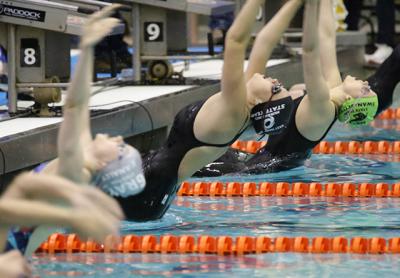 Julia Brierley, arching at the start of the 100-yard backstroke above, placed second in that event and second in the 100 breaststroke. She will compete in the Y.M.C.A. national meet in Greensboro, N.C., next month.